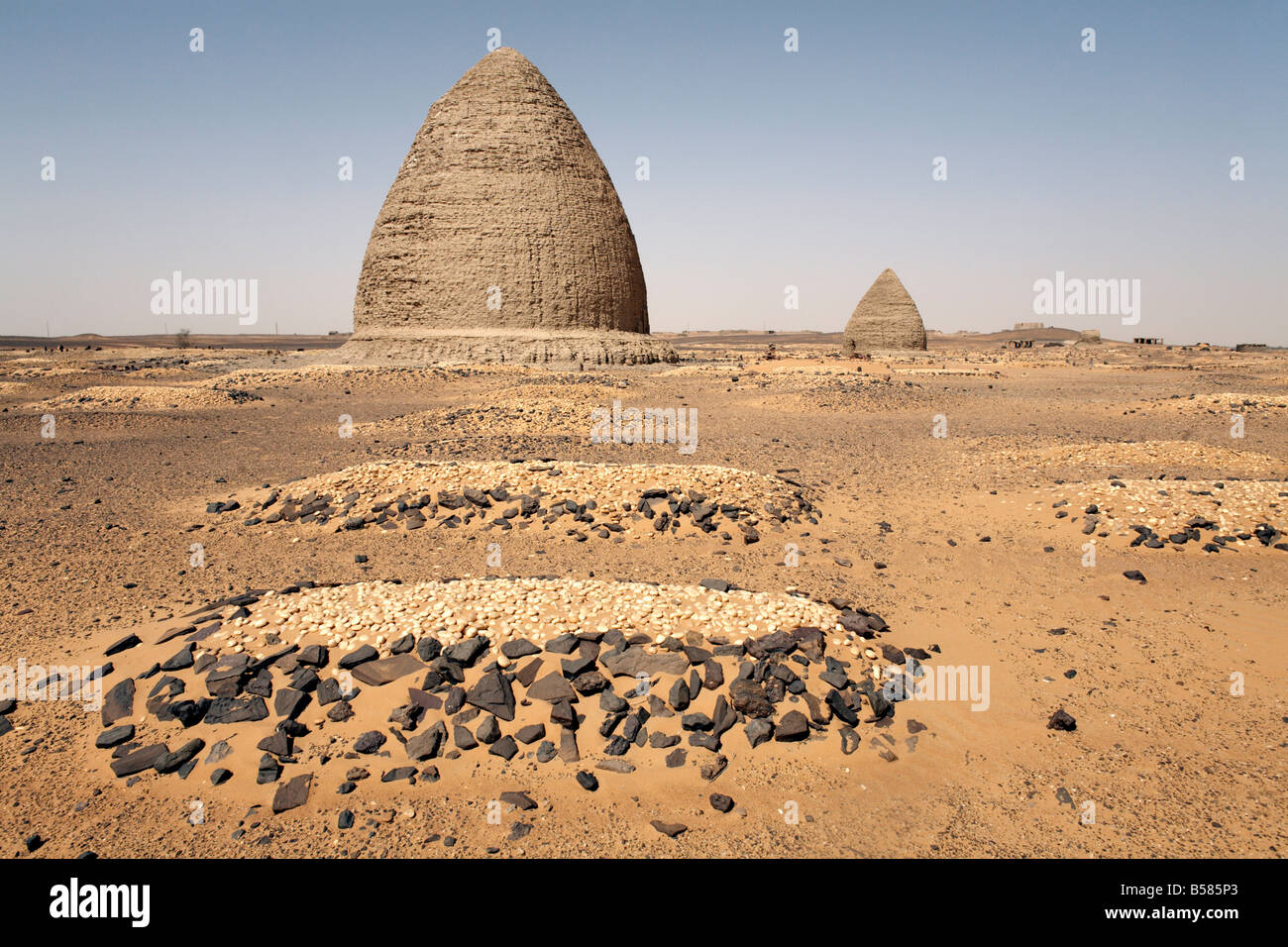 Graves, including beehive graves (Tholos tombs), in the desert near the ruins of the medieval city of Old Dongola, Sudan, Africa Stock Photo