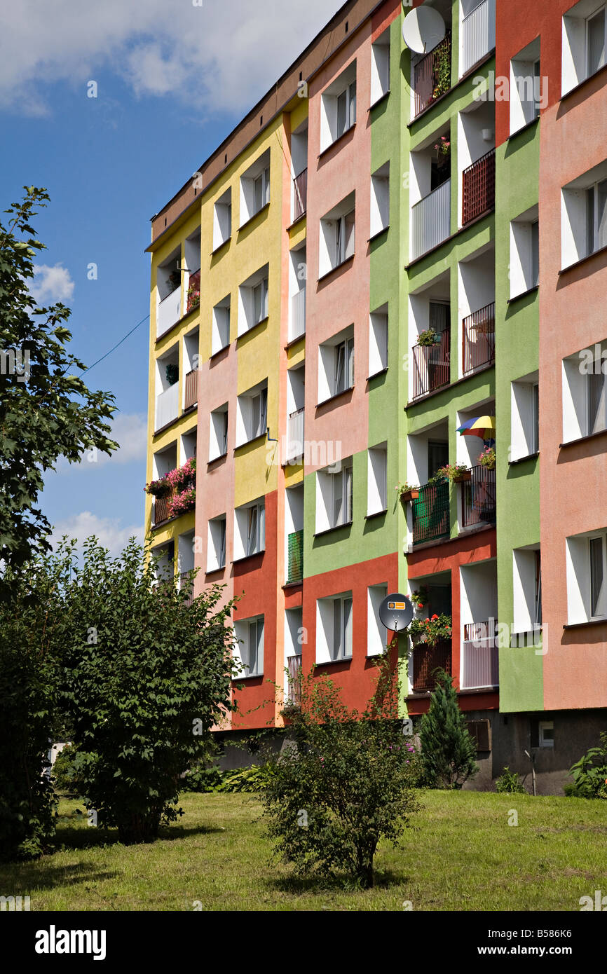 Brightly painted block of flats on housing estate Poland Stock Photo