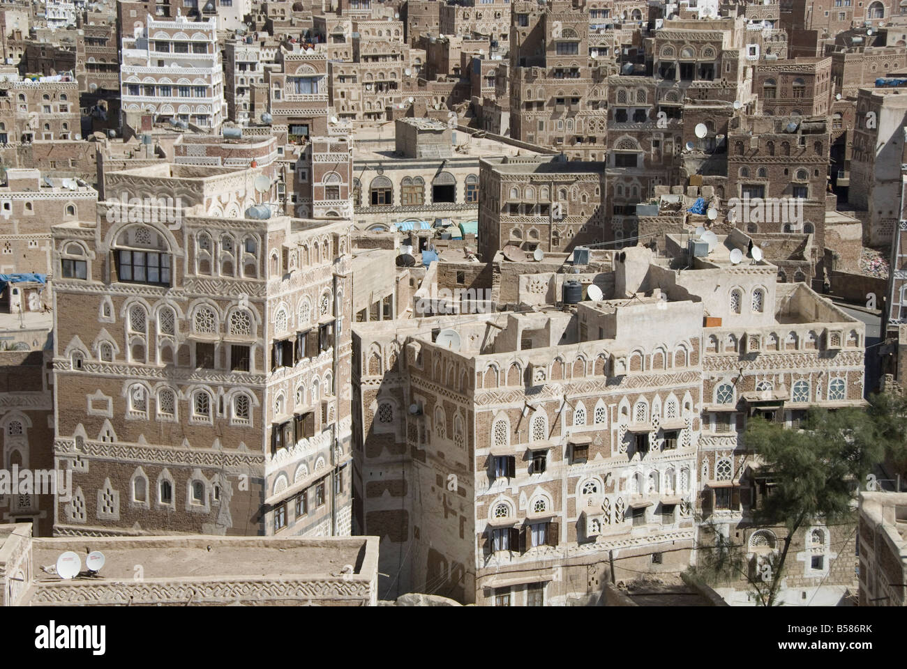 Traditional ornamented brick architecture on tall houses in Old City, Sana'a, UNESCO World Heritage Site, Yemen, Middle East Stock Photo