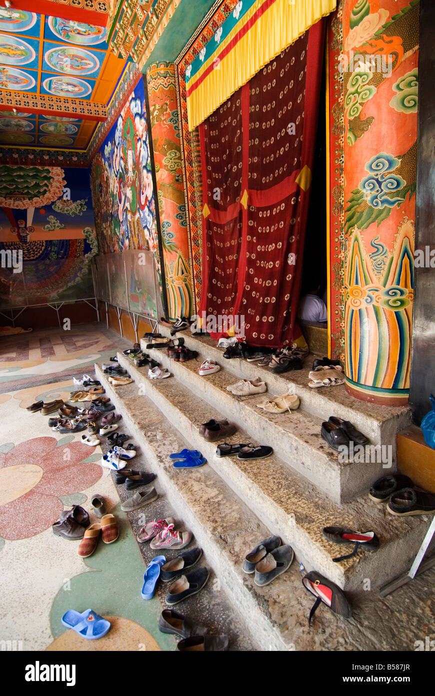 Shoes outside prayer room, Nanwu temple, Kangding, Sichuan, China, Asia Stock Photo