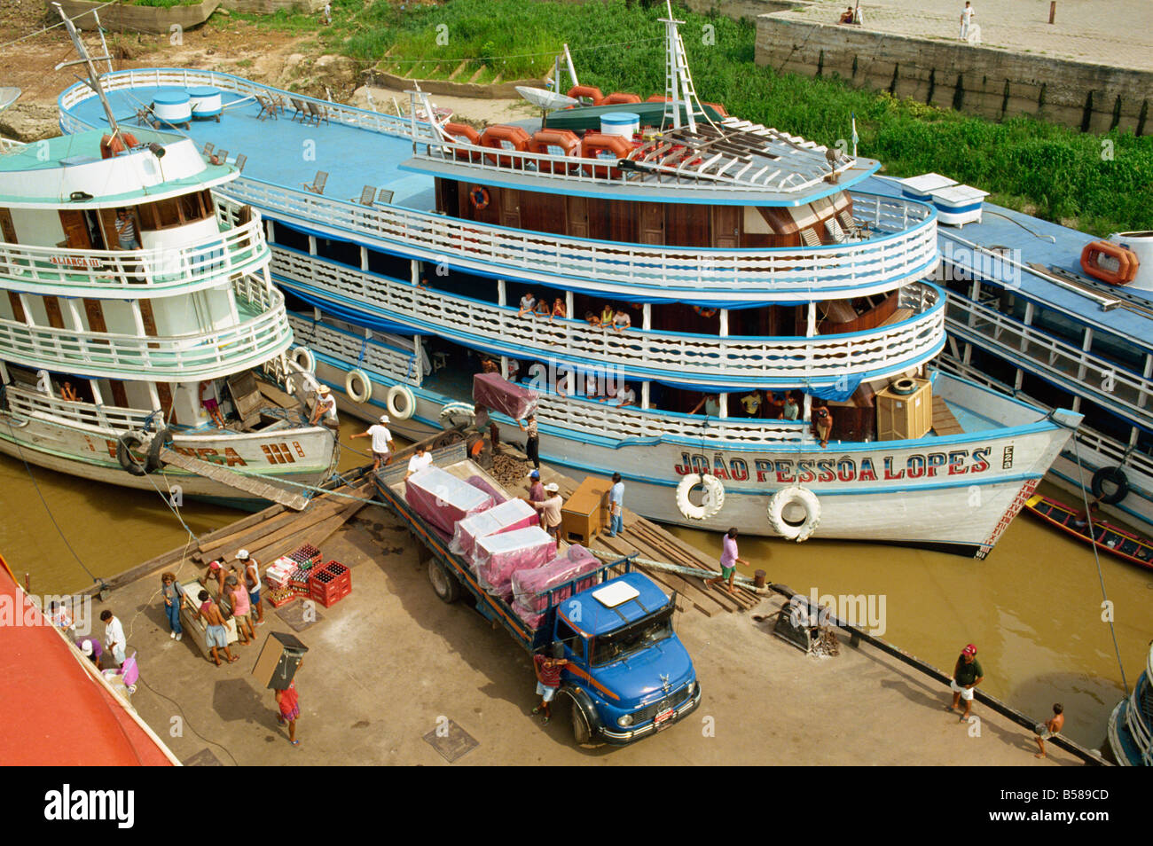 River boats on the quayside being unloaded at Parintins in the Amazon area of Brazil South America Stock Photo