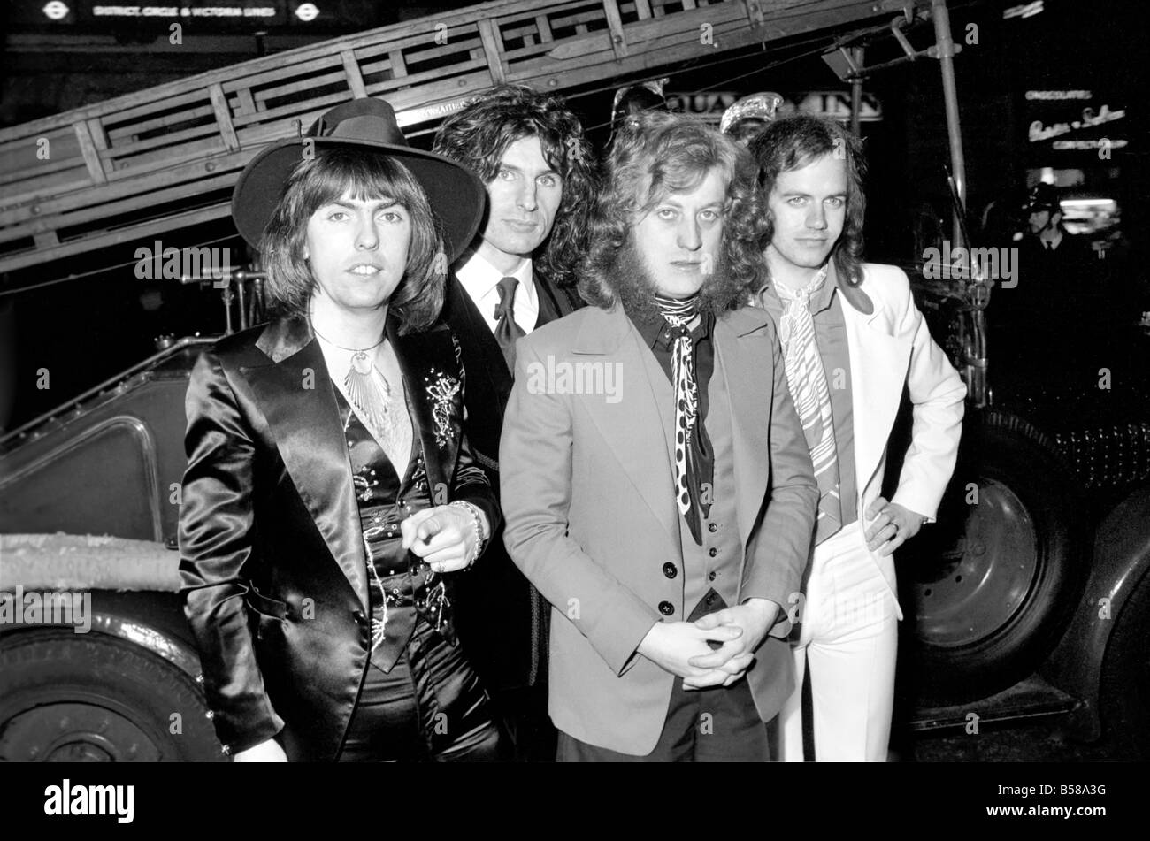 The Slade pop group on fire engine. L to R Dave Hill, Don Powell, Jimmy Lea, Noddy Holder. February 1975 75-00872-003 Stock Photo
