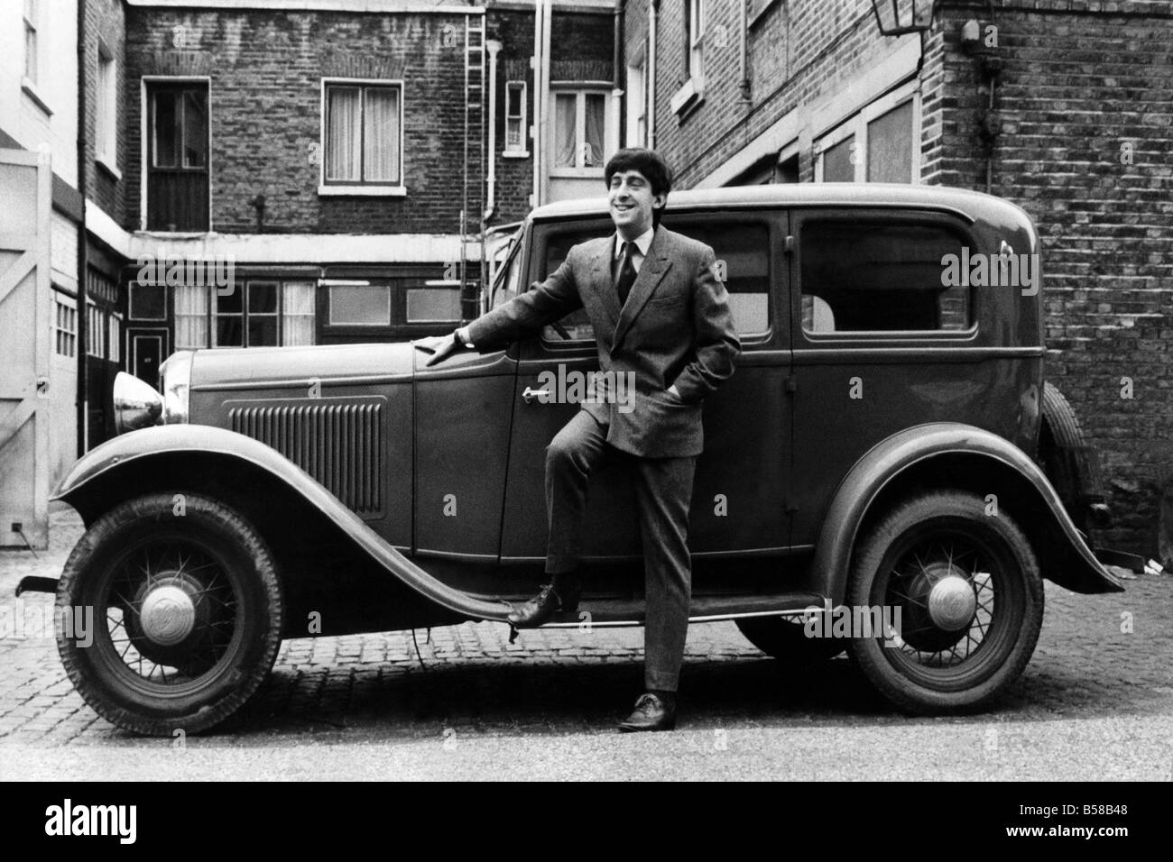 Playright Michael Hastings with his Ford B Type 1923 model, 4 cylinders, 32 horsepower, colour - red. February 1968 P005860 Stock Photo