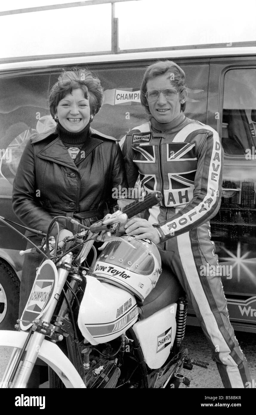 Motorbike stunt: Dave Taylor lives at Barnhurst near Bexley Kent. He is married with three children. Dave is performing a tank stand at 90 M.P.H. along the finishing straight at brands hatch racing circut. This was a slow run. He has done this at over 100 M.P.H. April 1977 77-02121 Stock Photo