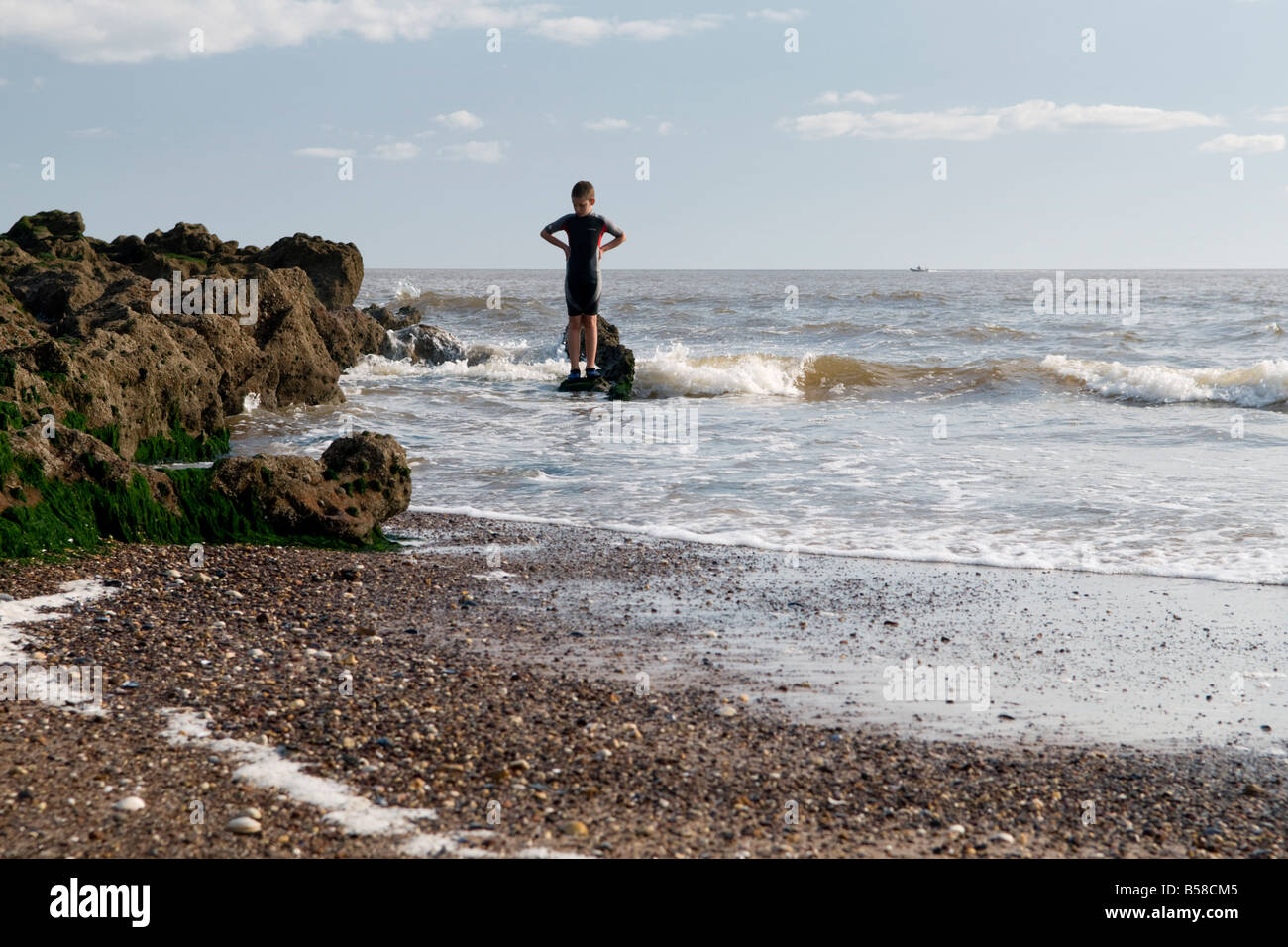 Kid Playing on Rocks, Exmouth, Devon, UK Stock Photo Alamy