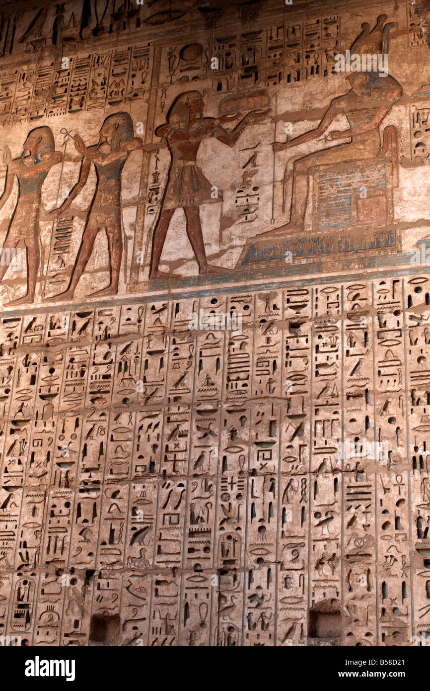 Images and hieroglyphics adorn the walls of Medinet Habu temple complex, Thebes, Egypt, North Africa, Africa Stock Photo