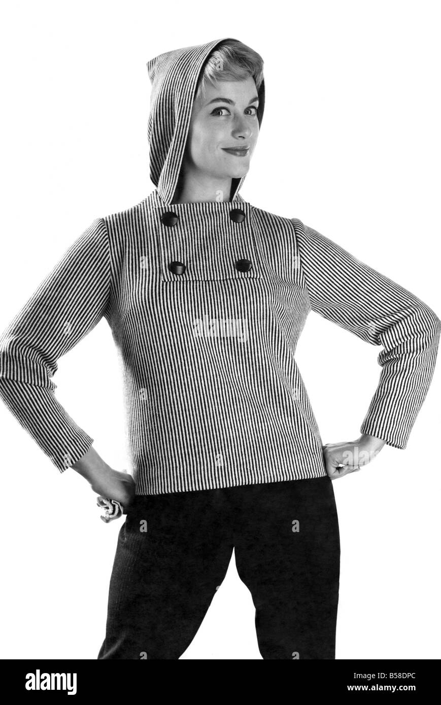 Reveille Fashions: Button up the cold, model wearing hooded jumper.  January 1959 P006939 Stock Photo