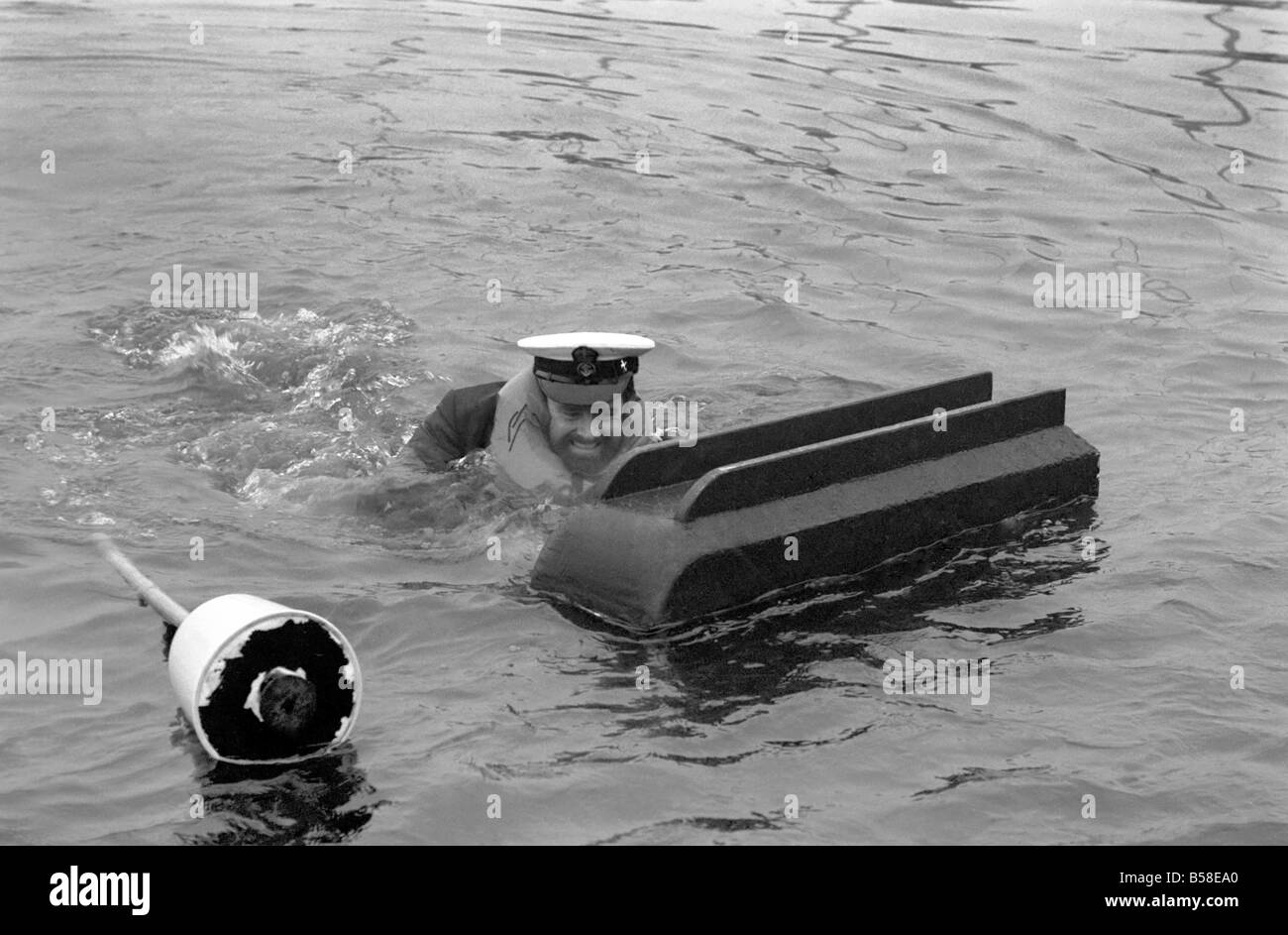 Petty officer Alan Hogarth on skis. Petty officer Alan Hogarth 33, tried out his device in Plymouth Harbour today, (he walks on Stock Photo