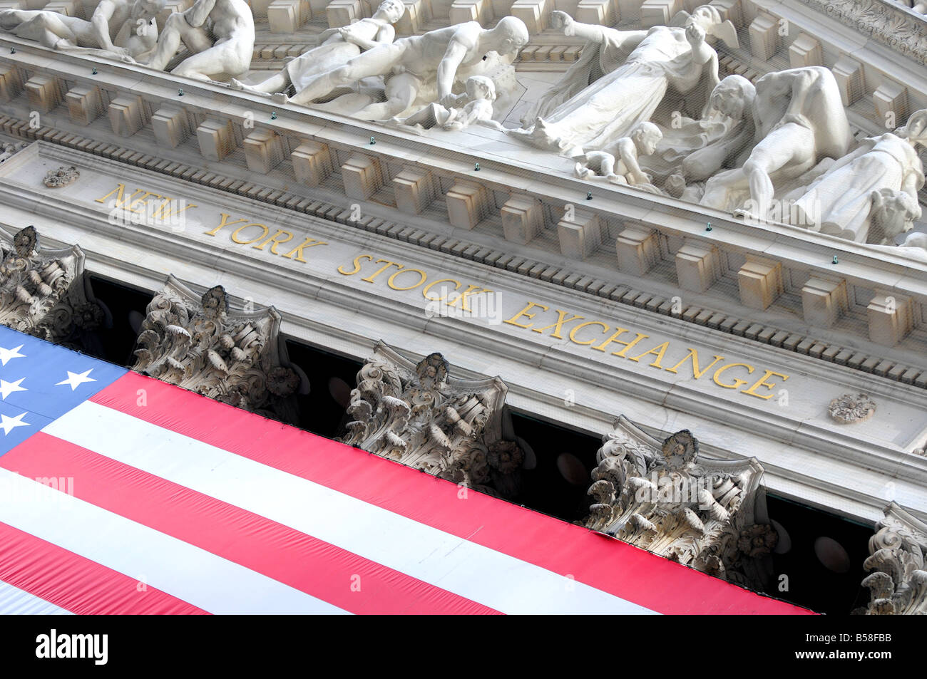 diagonal view of 'new york stock exchange' building and american flag Stock Photo
