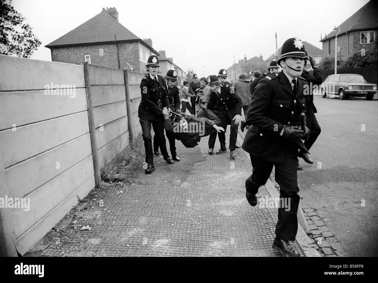 The Birmingham Riots. A demonstrator is carried away by police after ...
