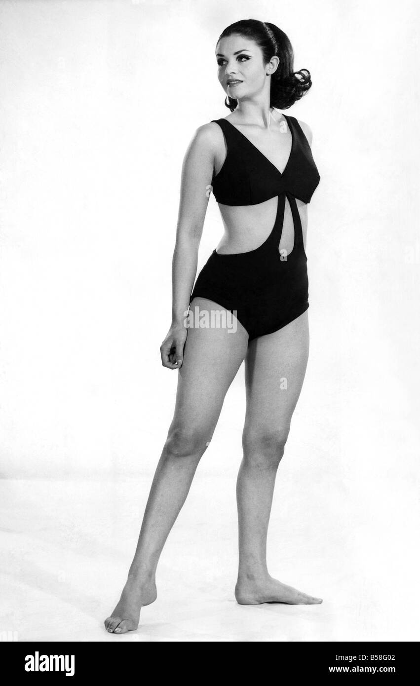 Reveille Fashions: Peak-a-boo. A giant tear-drop cut-out at centre, more cut-outs at sides. This one-piece swimsuit is a sizzling sensation in red-hot stretch nylon. It clings and moves so easily with you. August 1966 P006660 Stock Photo