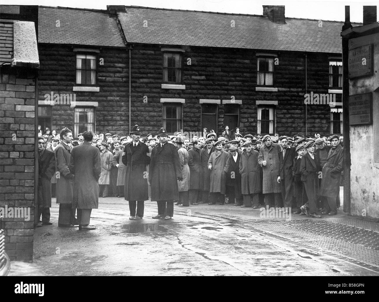 Relatives and friends wait anxiously for the latest news of the Easington Pit disaster Stock Photo