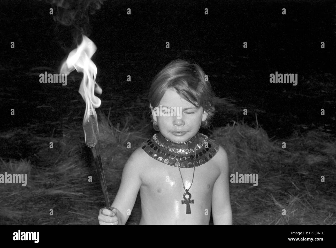 Unusual: Children. Fire Eater. 9 year old Tony Walls. December 1976 76-07502-009 Stock Photo
