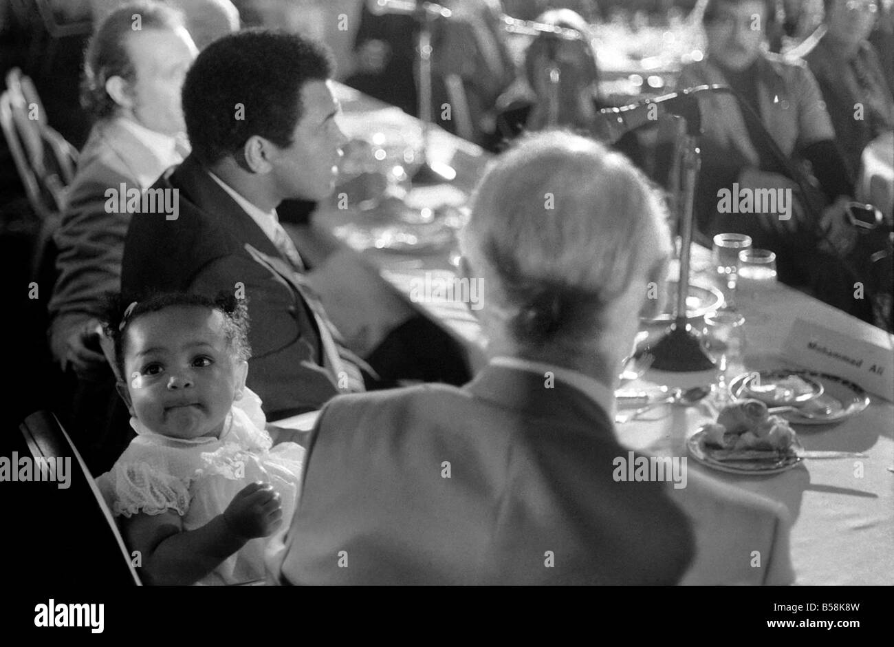 Cassius Clay. Muhammad Ali and daughter Hannah. Ali has baby sitter problems. World Champion Muhammad Ali was due to attend a press conference luncheon at the Cafe Royal to publicise his film. But there was a double snag for the •Champê to solve-first his baby sitter reported sick, then his wife announced that she wanted to go shopping Stock Photo