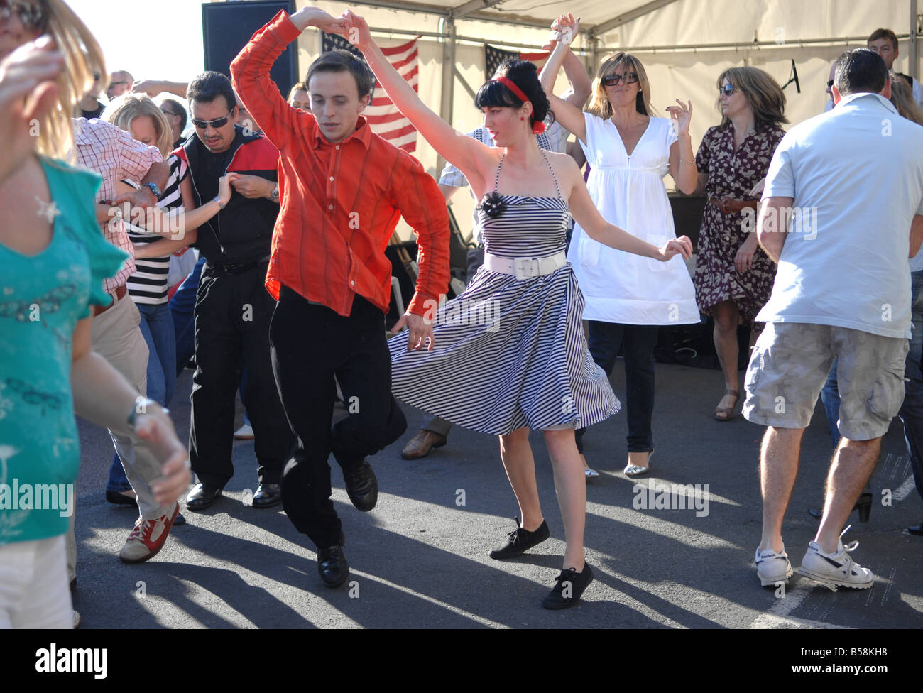 People dancing to live music at the Brightona motorcycle event on Brighton seafront UK Stock Photo