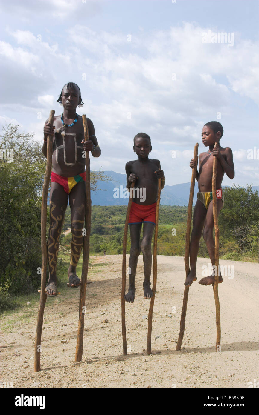 Dorze boys with body painting on stilts Chencha mountains Ethiopia Africa Stock Photo