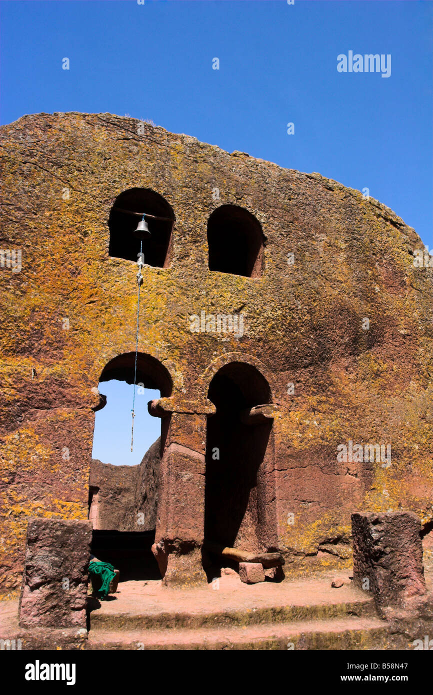 Priest in Bet Danaghel Church holding the Cross of King Lalibela. The  rock-hewn churches of Lalibela make it one of the greatest  Religio-Historical sites not only in Africa but in the Christian