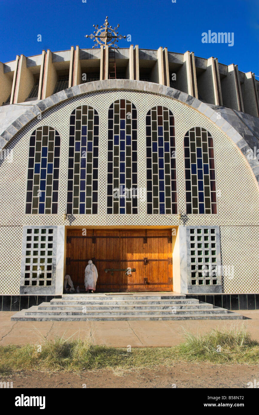 Pilgrim at doors of St Mary of Zion new church built by Haile Selassie in the 1960s Axum Ethiopia Africa Stock Photo