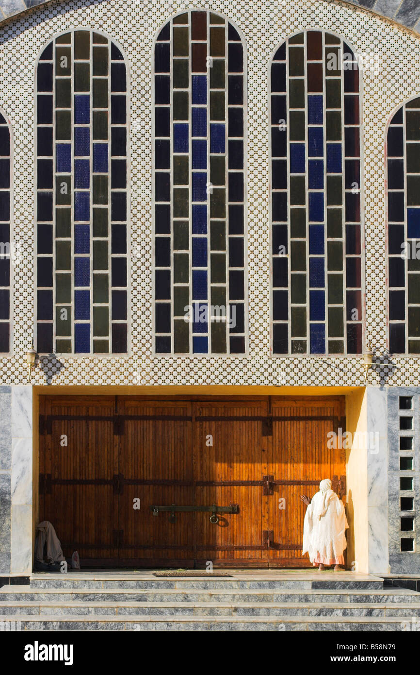 Pilgrim at doors of St Mary of Zion new church built by Haile Selassie in the 1960s Axum Ethiopia Africa Stock Photo