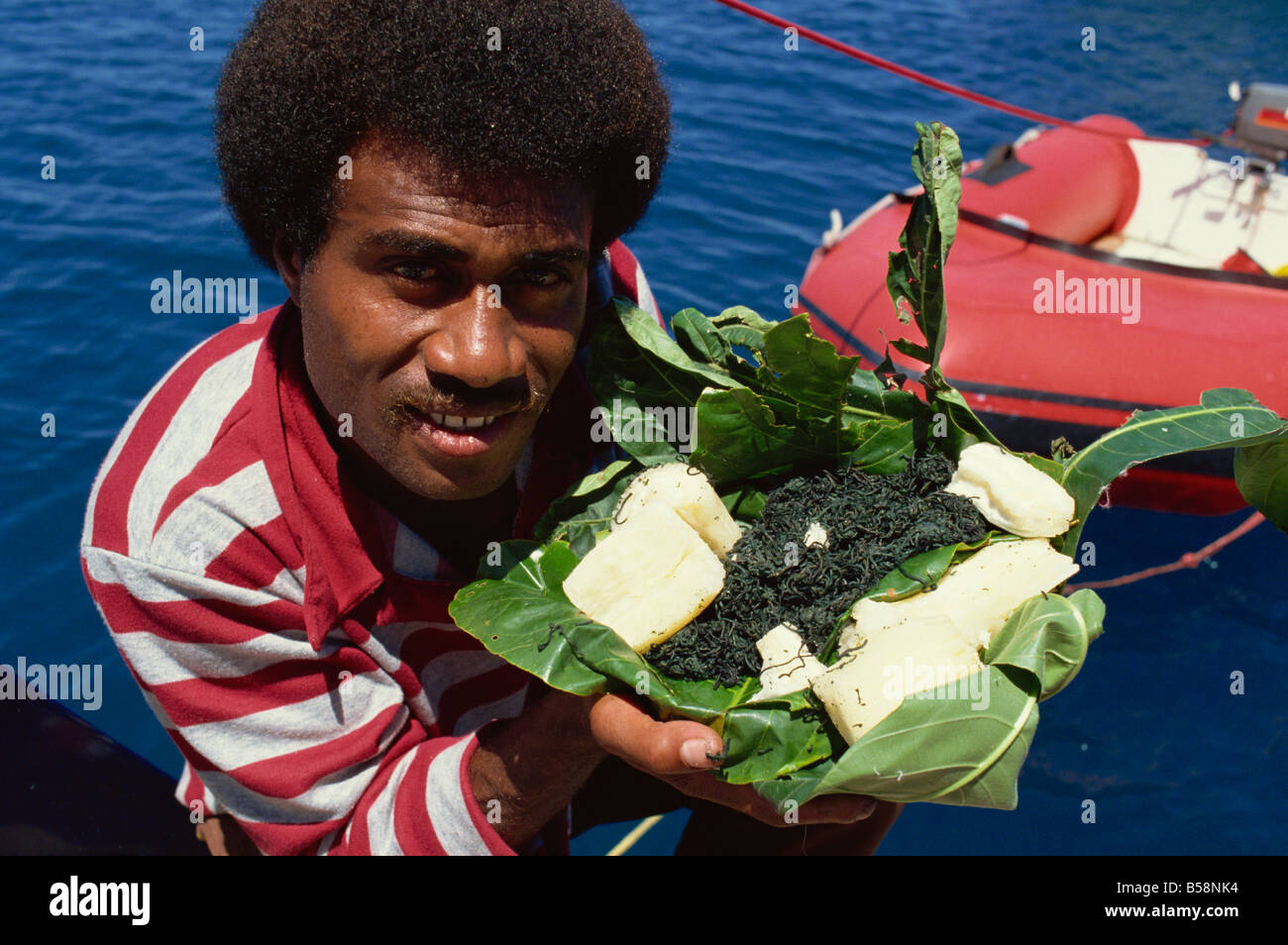 Fijian delicacies of cassava and balolo, Fiji, Pacific Islands, Pacific Stock Photo