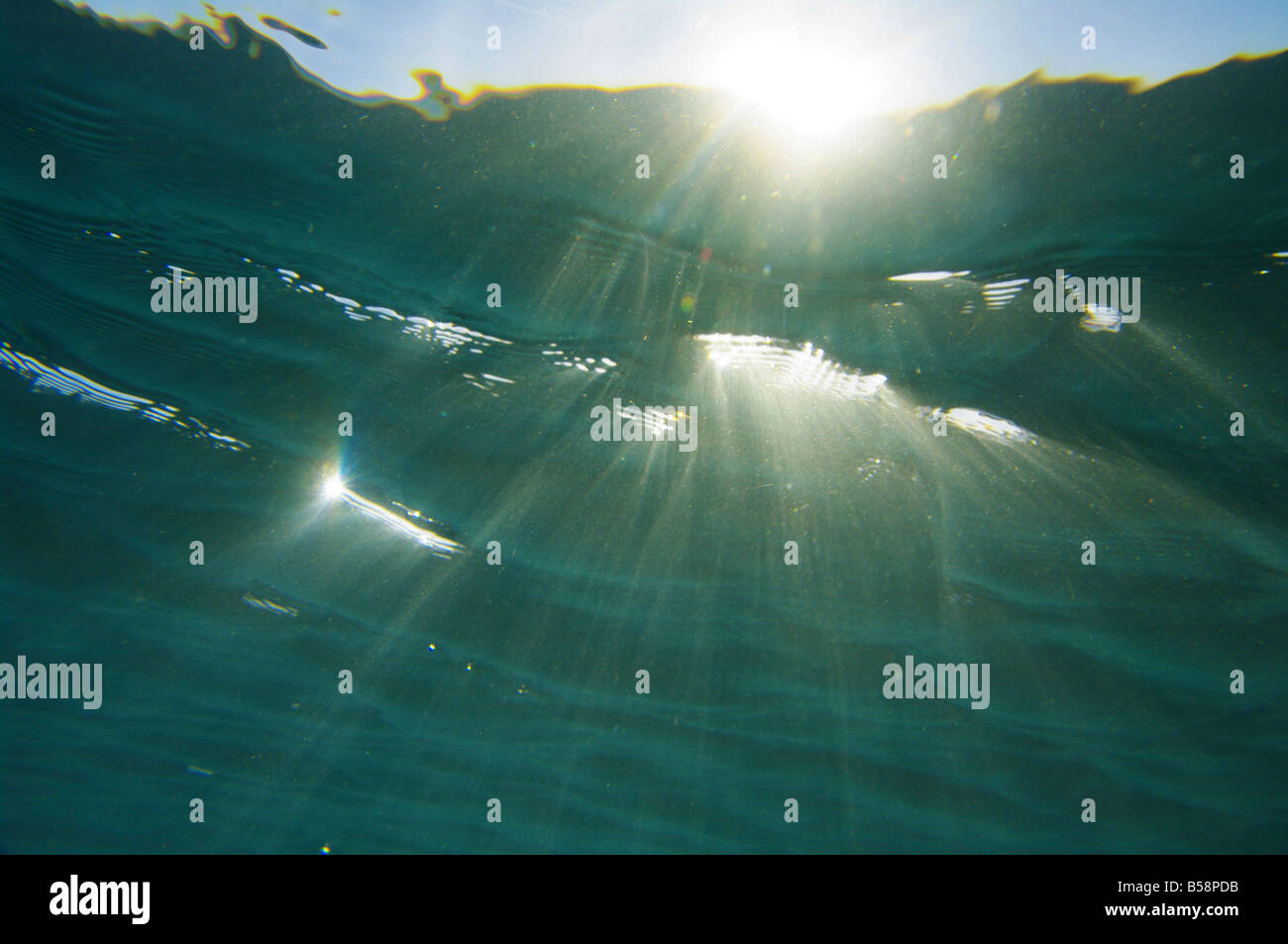 sun rays shines through water surface Stock Photo