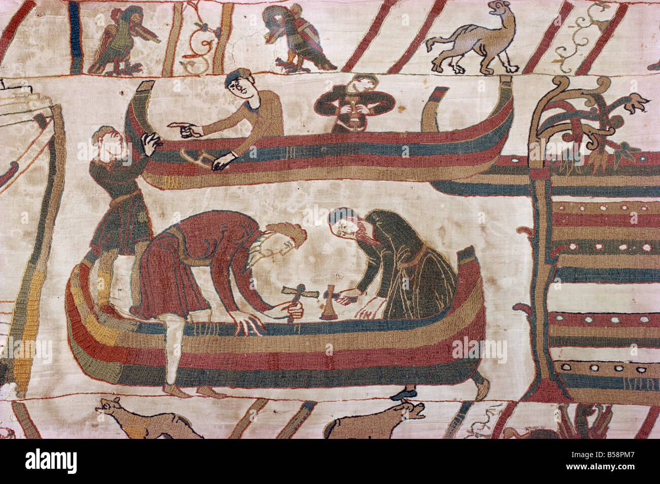 Building ships in preparation for war Bayeux Tapestry Bayeux Normandy France Europe Stock Photo