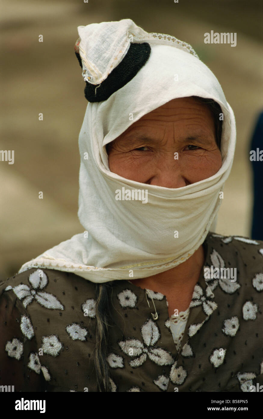 Traditional head dress of Uyghurs Minpeng Xinjiang China Asia Stock Photo