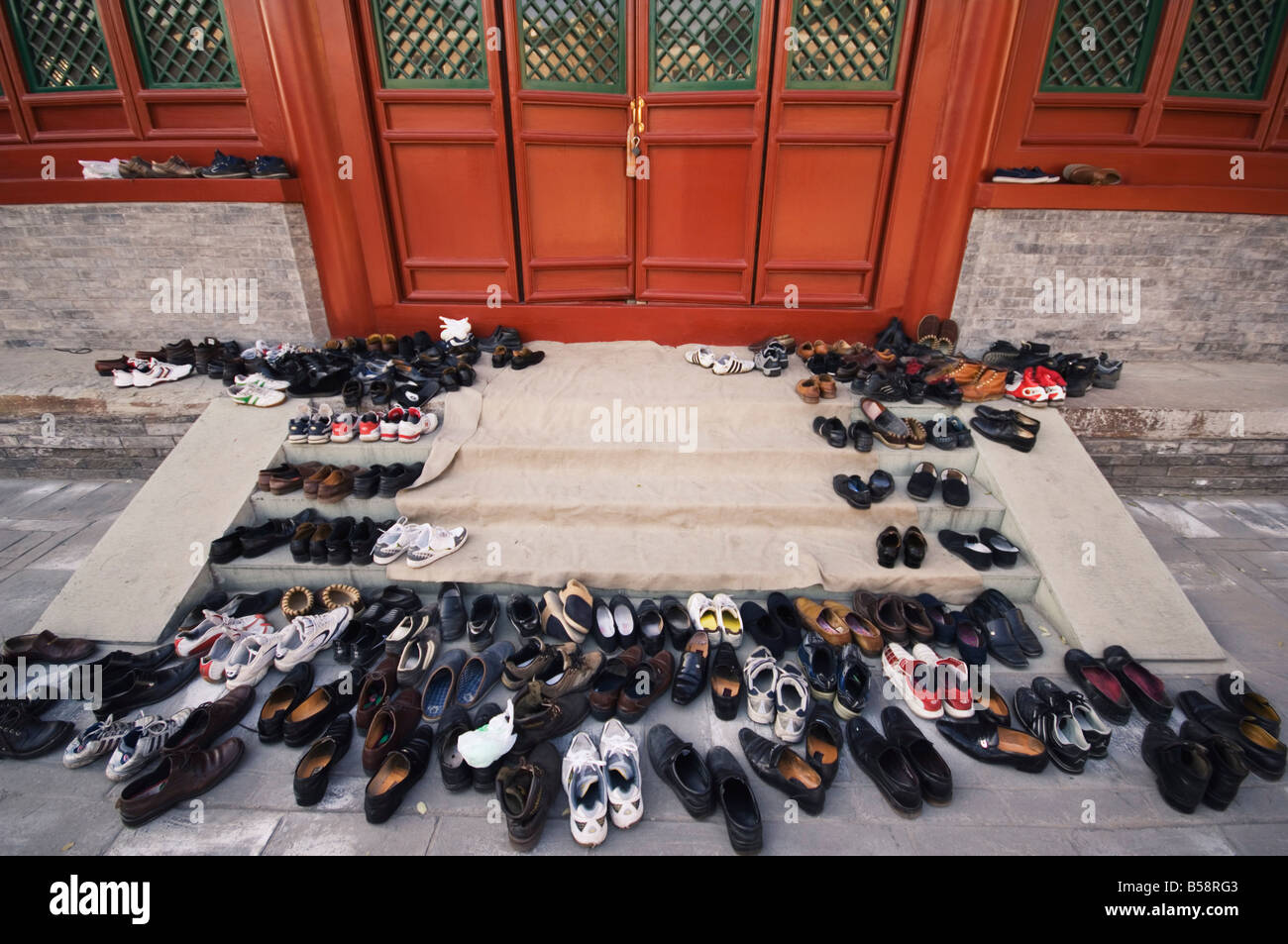 Shoes outside a prayer hall, Niujie mosque, Beijing, China Stock Photo