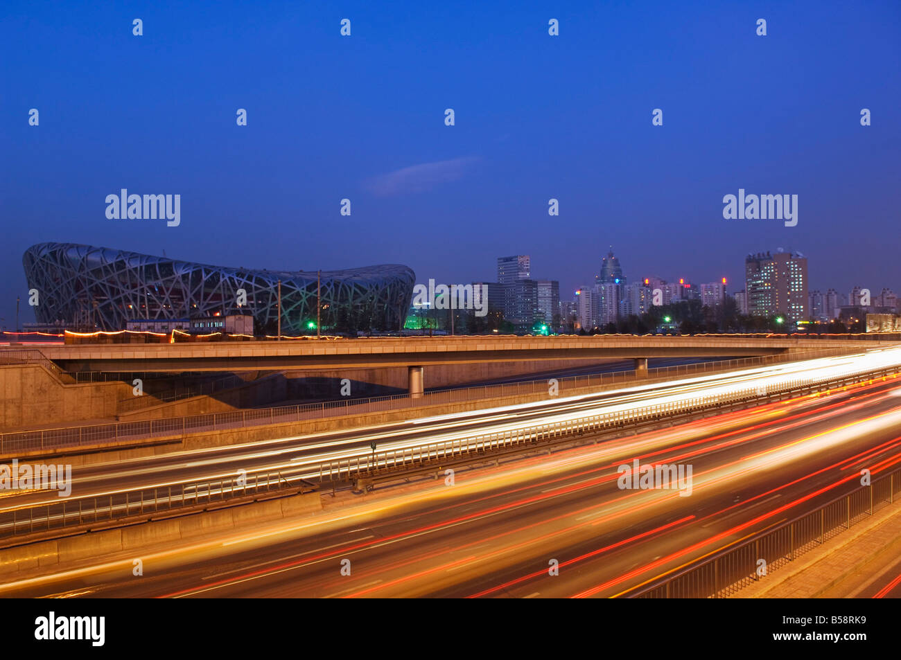 Car light trails at the National Stadium, 2008 Beijing Olympic venue, Beijing, China Stock Photo