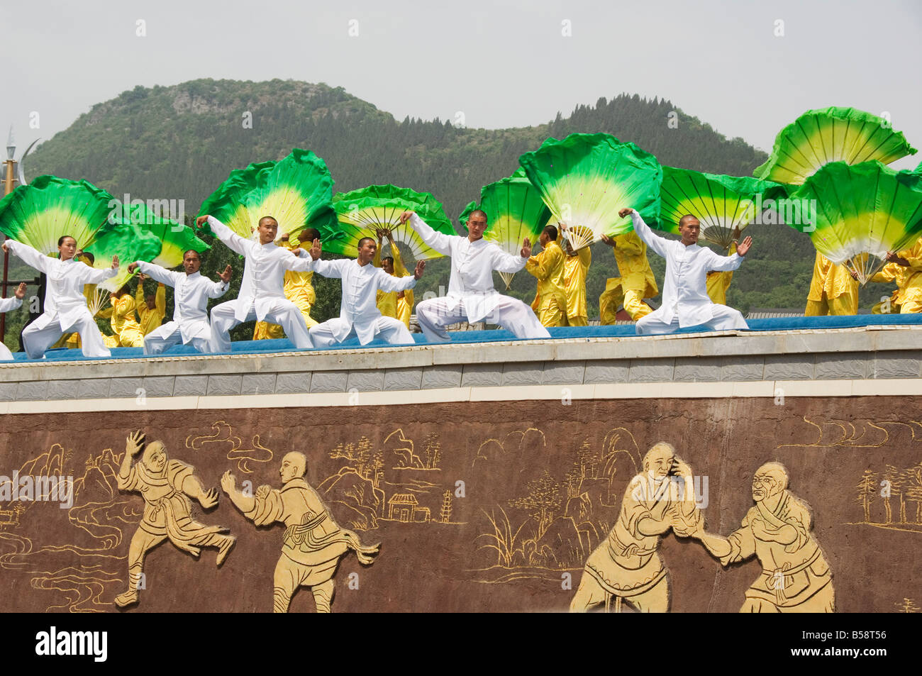 Kung fu students displaying their skills at a tourist show within Shaolin Temple, Shaolin, Henan Province, China Stock Photo