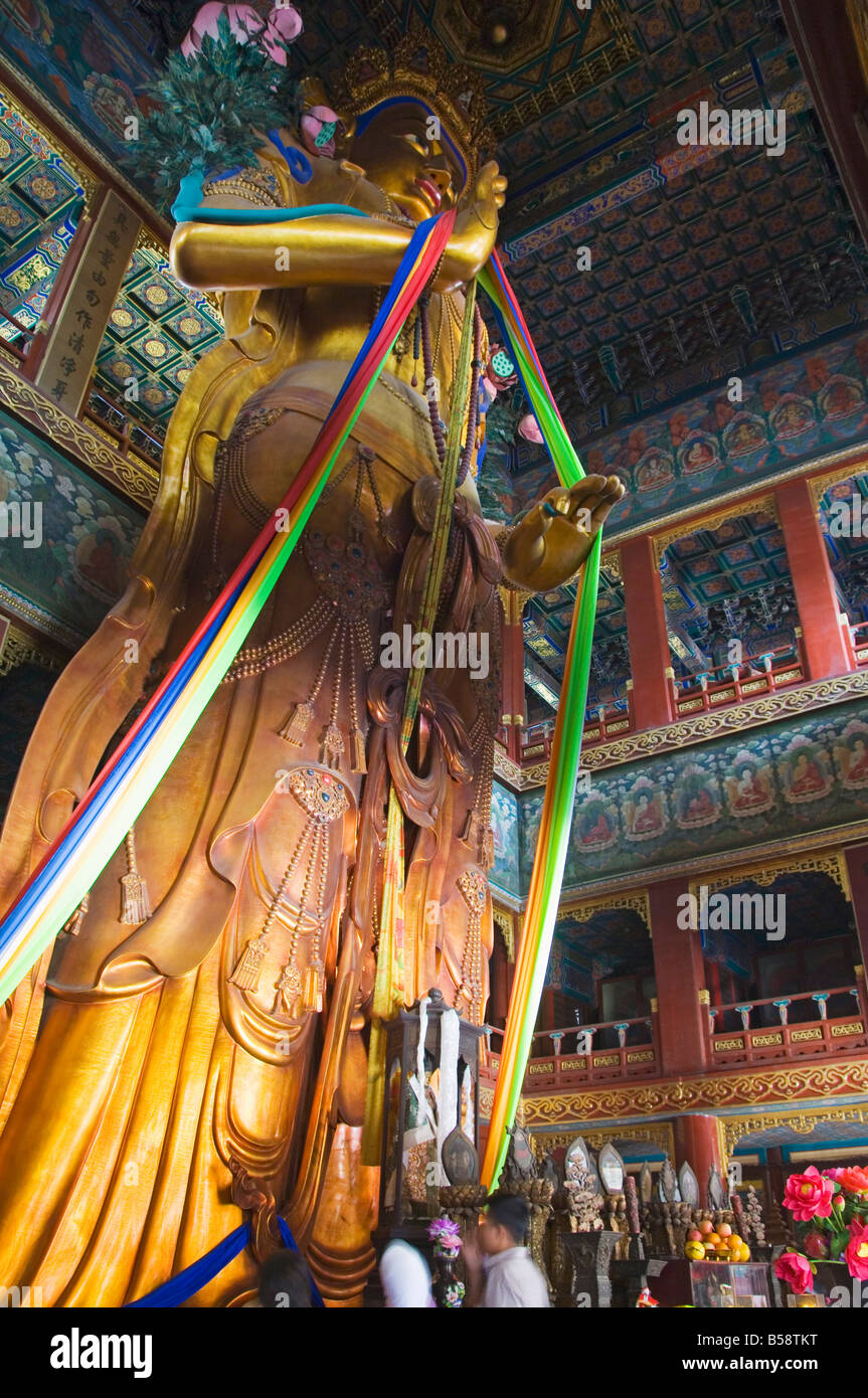 Sandalwood statue of Maitreya Buddha at Yonghe Gong Tibetan Buddhist Lama Temple, Beijing, China Stock Photo