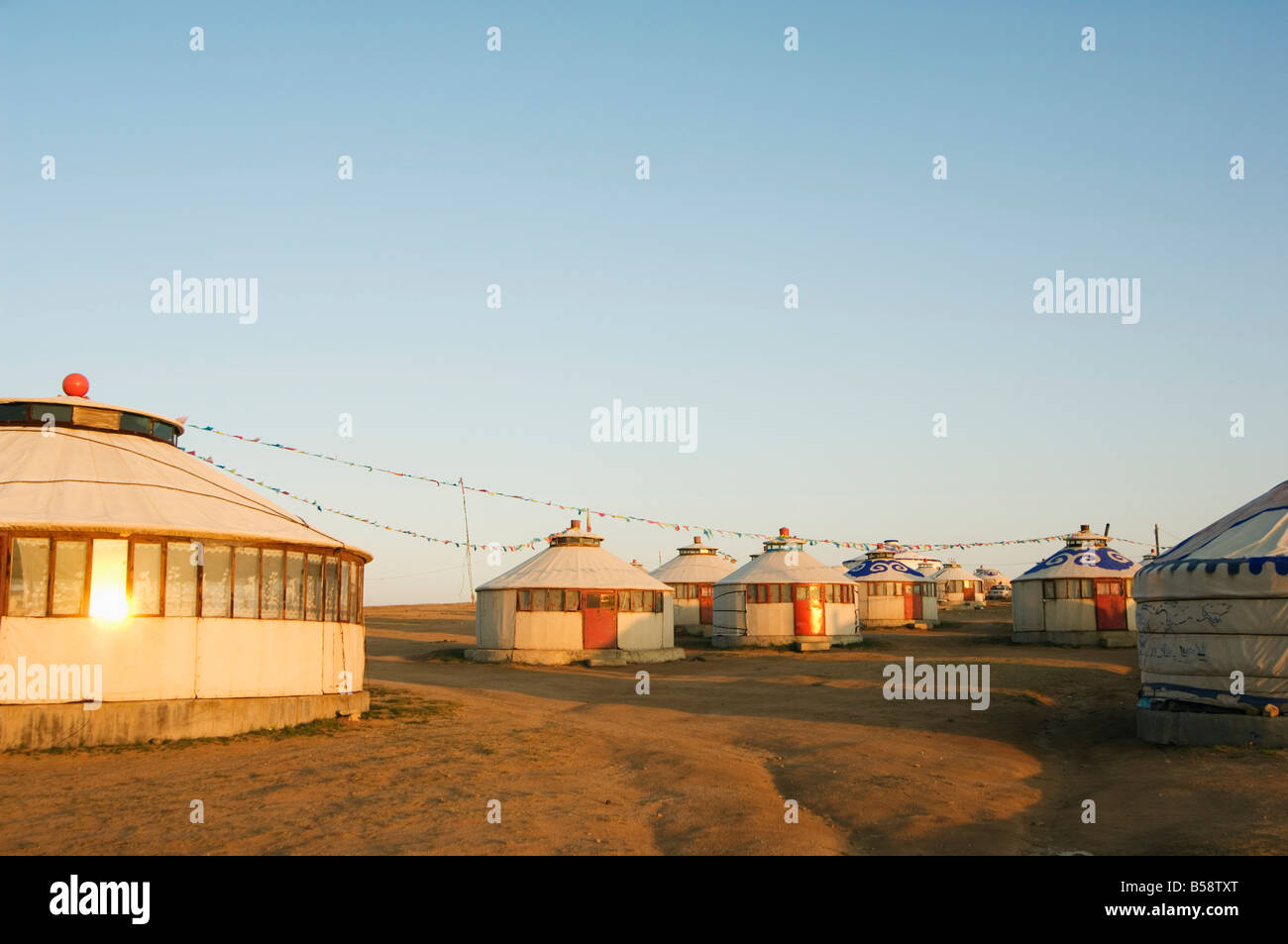Sunrise on nomad yurt tents, Xilamuren grasslands, Inner Mongolia province, China Stock Photo
