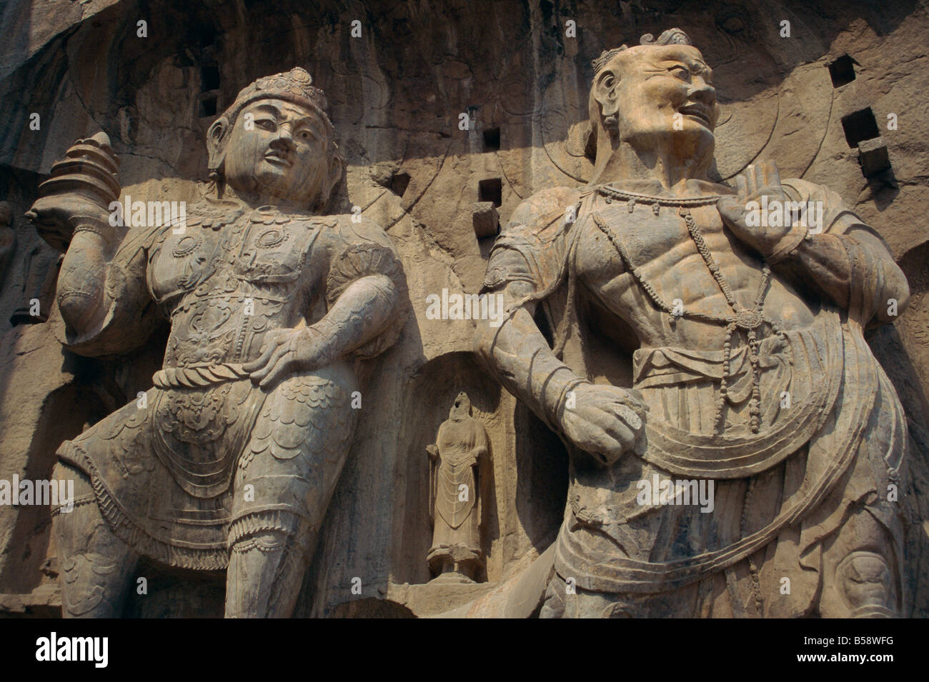 Statues carved in the rock at the Longman Buddhist caves at Luoyang Hunan Province China J Sweeney Stock Photo