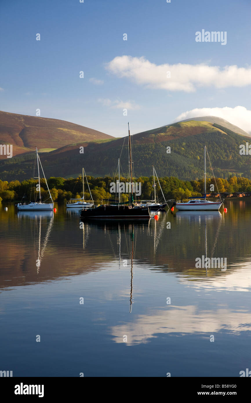 View over Derwentwater towards sailing boats in autumn, Lake District, Cumbria Stock Photo