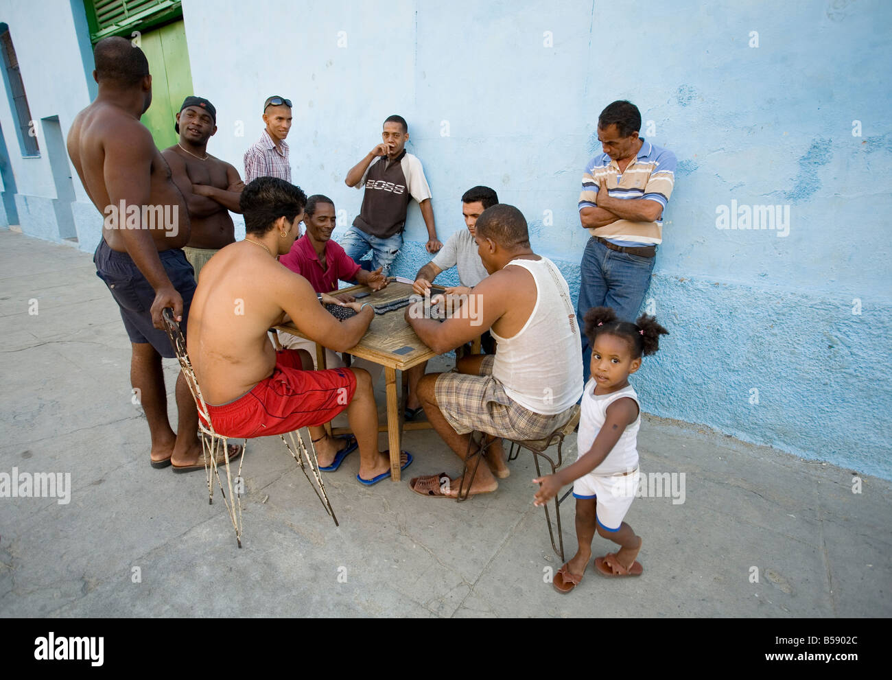 Men playing dominoes in the street, Santa Clara, Cuba Stock Photo