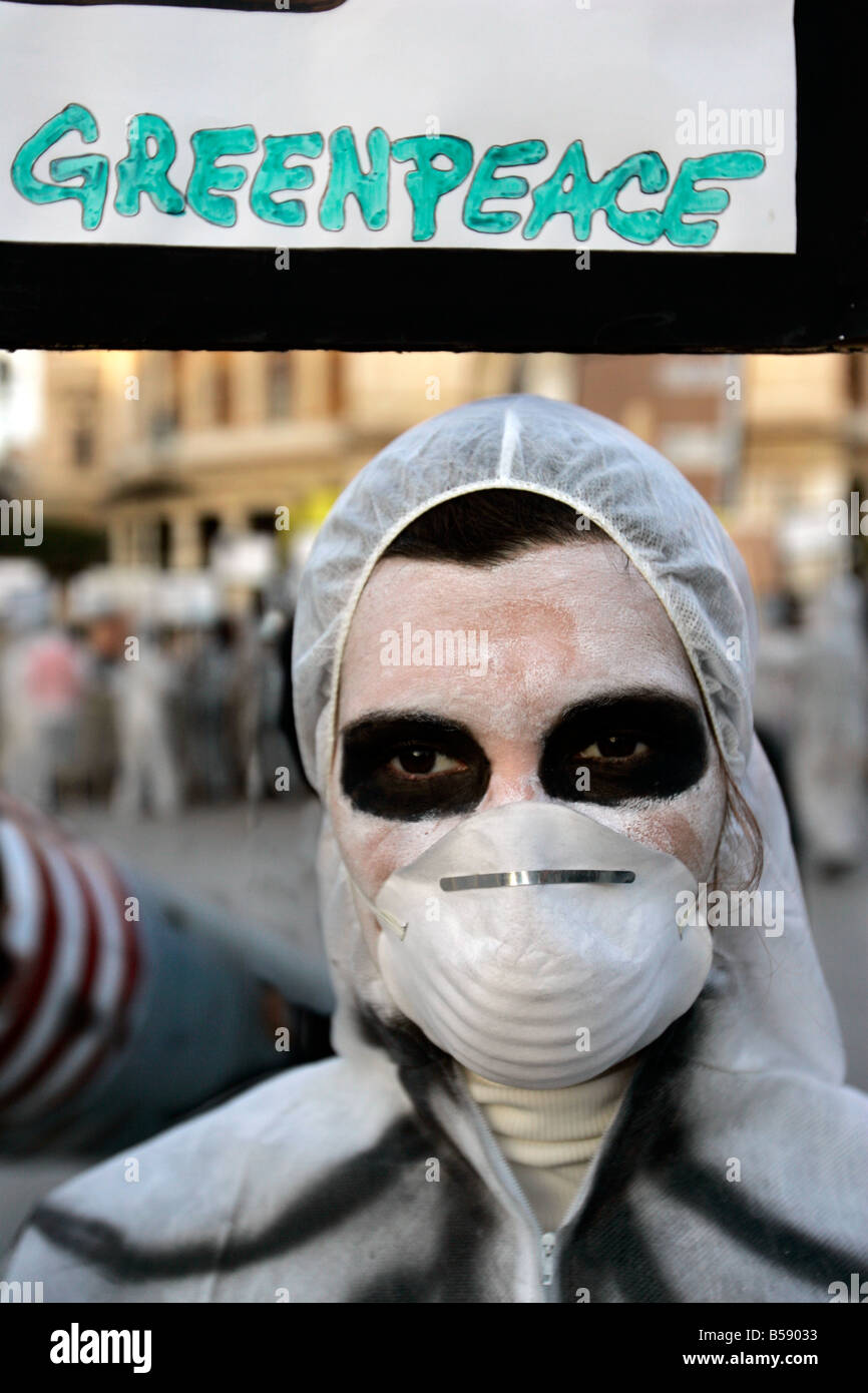 Woman wearing a mask at Greenpeace rally, Palermo, Sicily, Italy Stock Photo