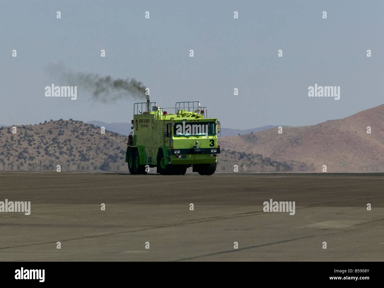 Airport Fire engine Tender driving to stand by position on runway Stock Photo