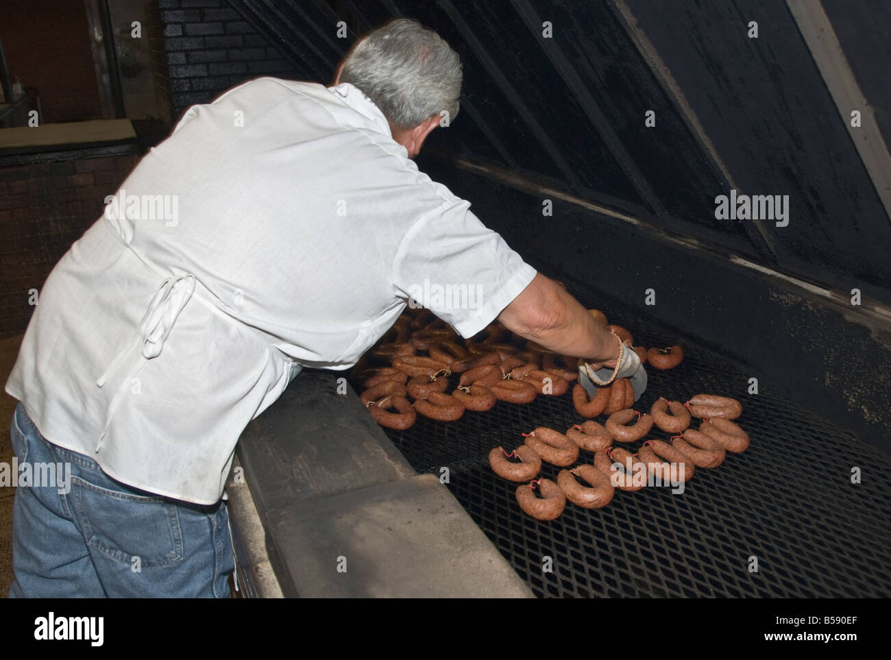 Texas Lockhart Kreuz Market barbecue smoked meat restaurant sausage in smoker oven Stock Photo