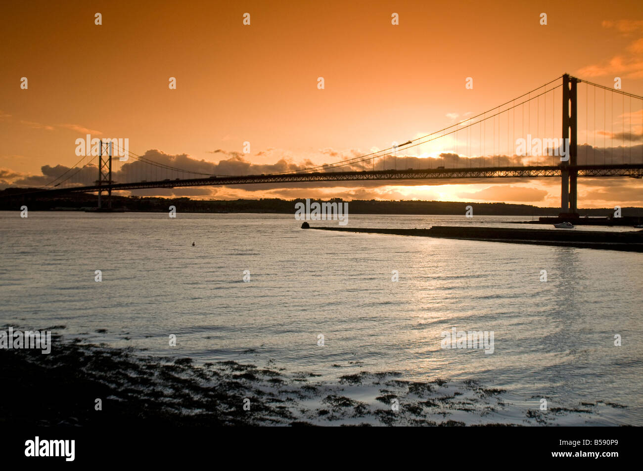 Autumn evening light over the Forth Road Bridge from North Queensferry Fife Region Scotland UK Stock Photo