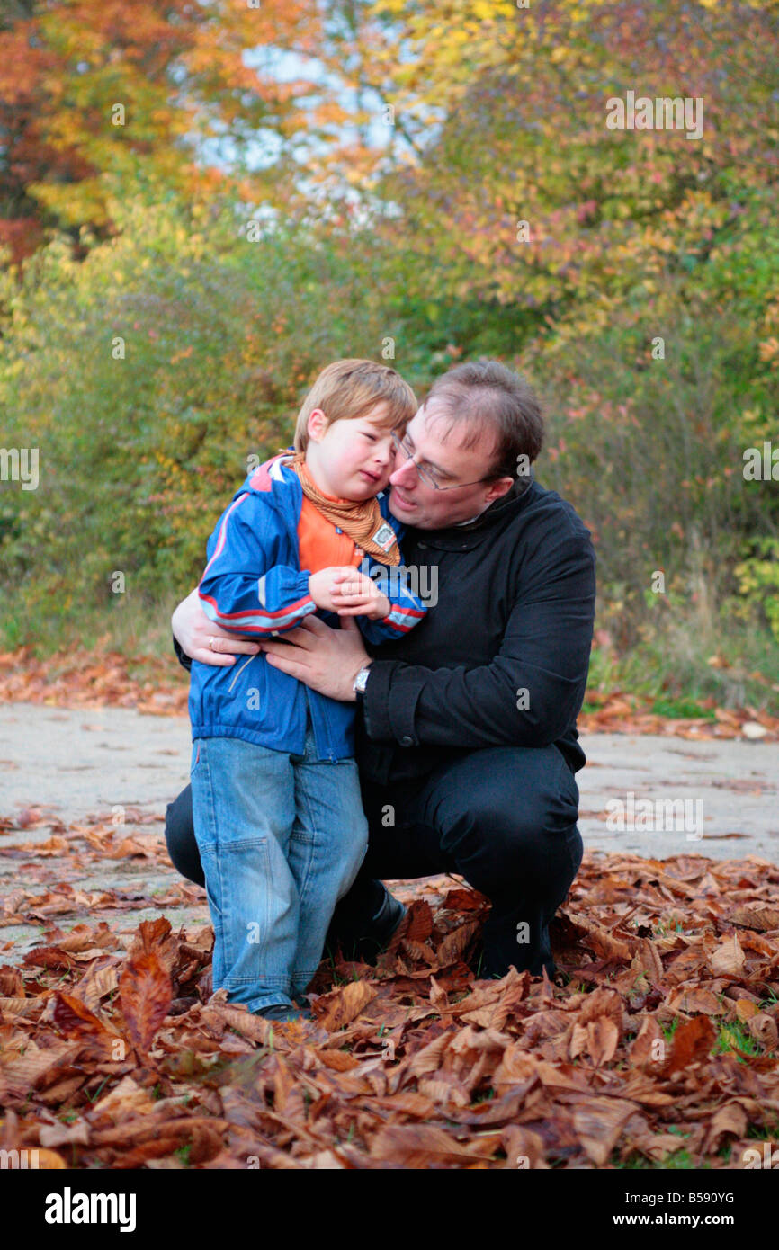 a father consoling his sad little son Stock Photo - Alamy