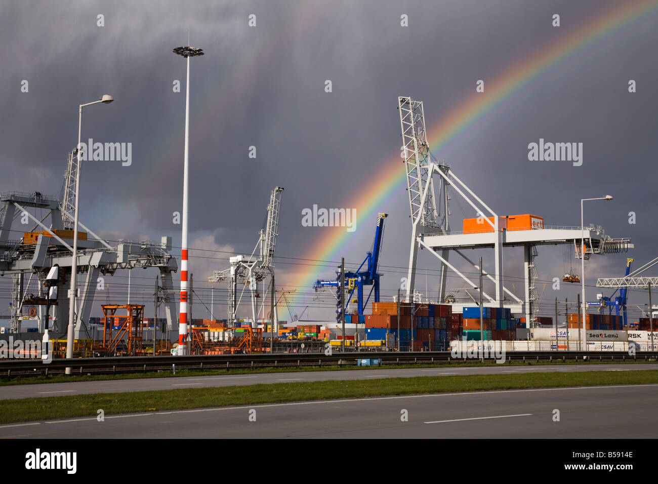 Containers and rainbow at the Pernis cargo terminal near Rotterdam. Holland. The Netherlands (42) Stock Photo
