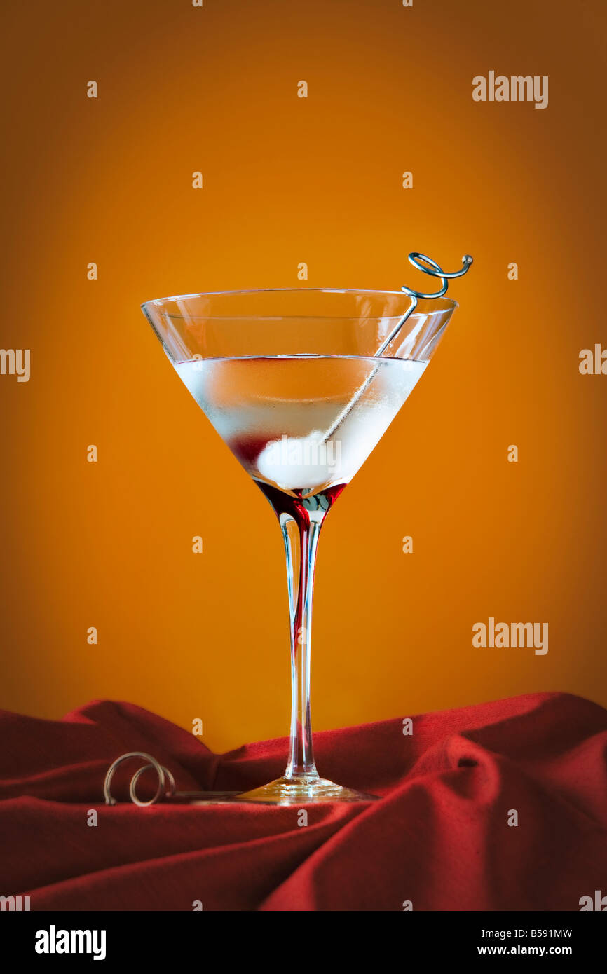 martini with onion on orange background Stock Photo