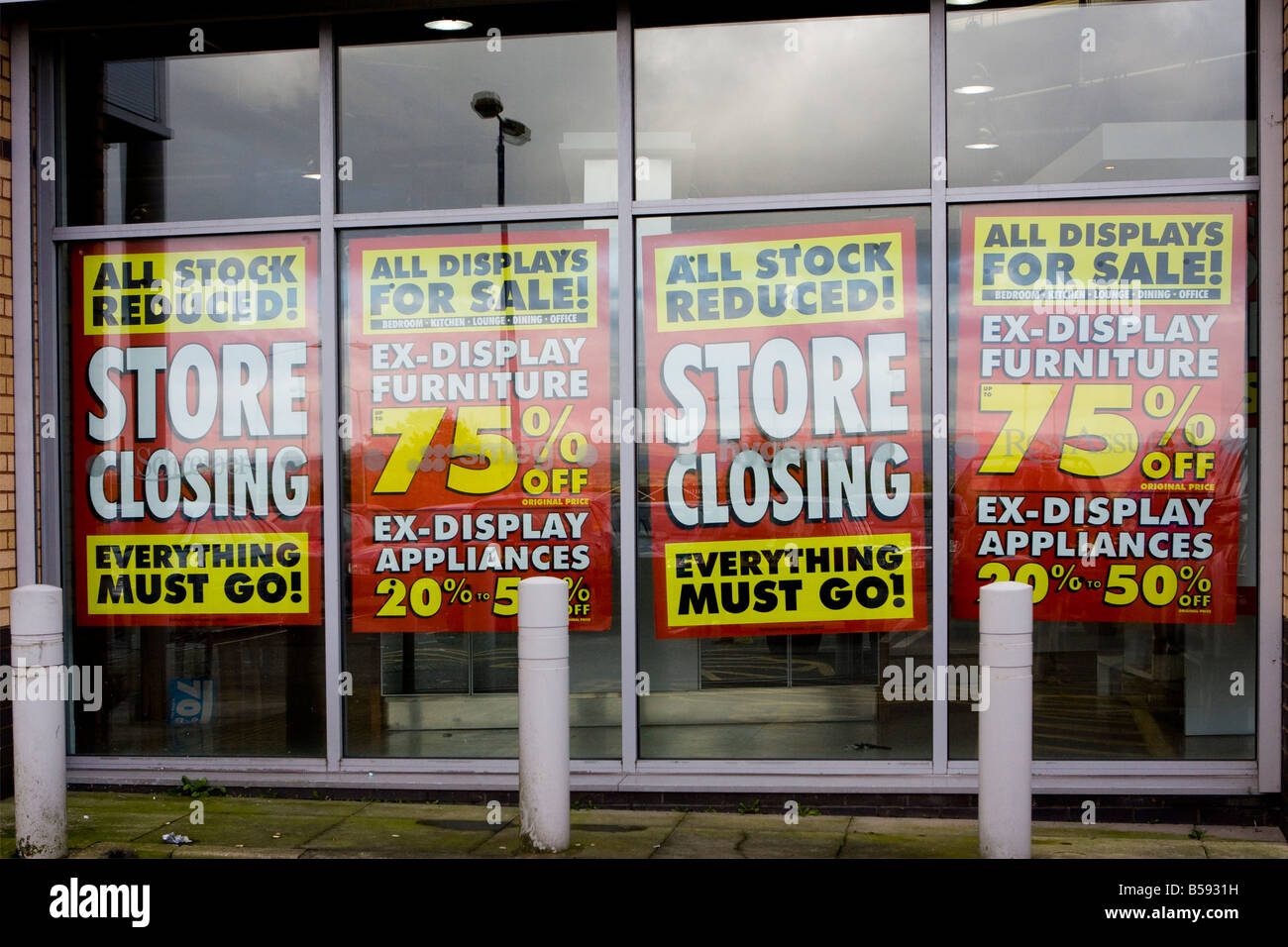 Store closure 75% off banners advertising MFI Oldham Manchester store closing closer view Stock Photo