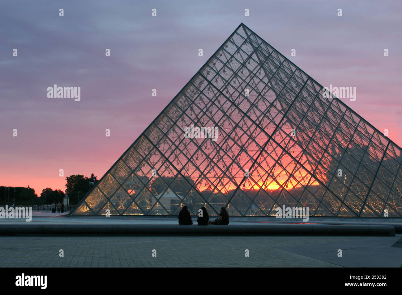 Paris - pyramid in Louvre by sunset Stock Photo