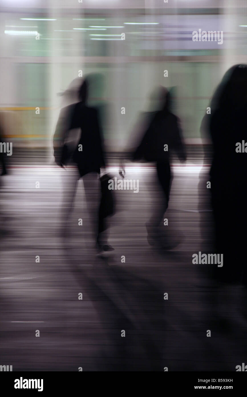 two people walking in street at night Stock Photo - Alamy