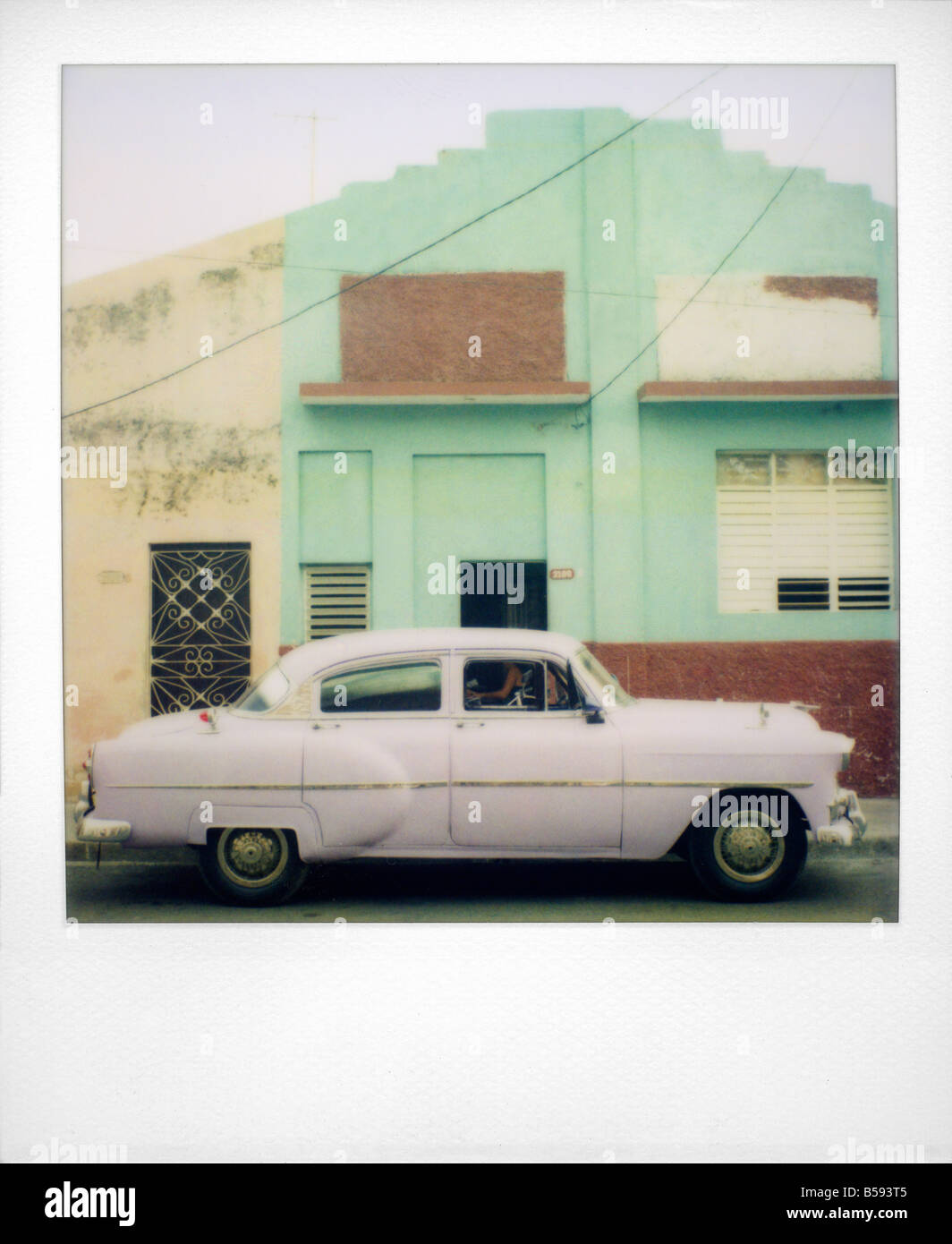 Polaroid of purple classic American car Cienfuegos Cuba West Indies Central America Stock Photo