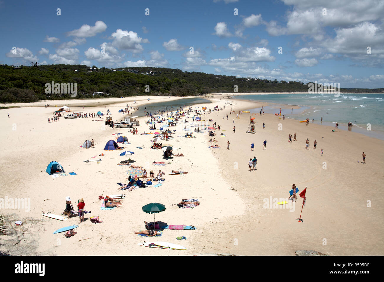 Cylinder beach on a summer day with people swimming in the sea and sunbathing on North Stradbroke Island Queensland QLD Australi Stock Photo