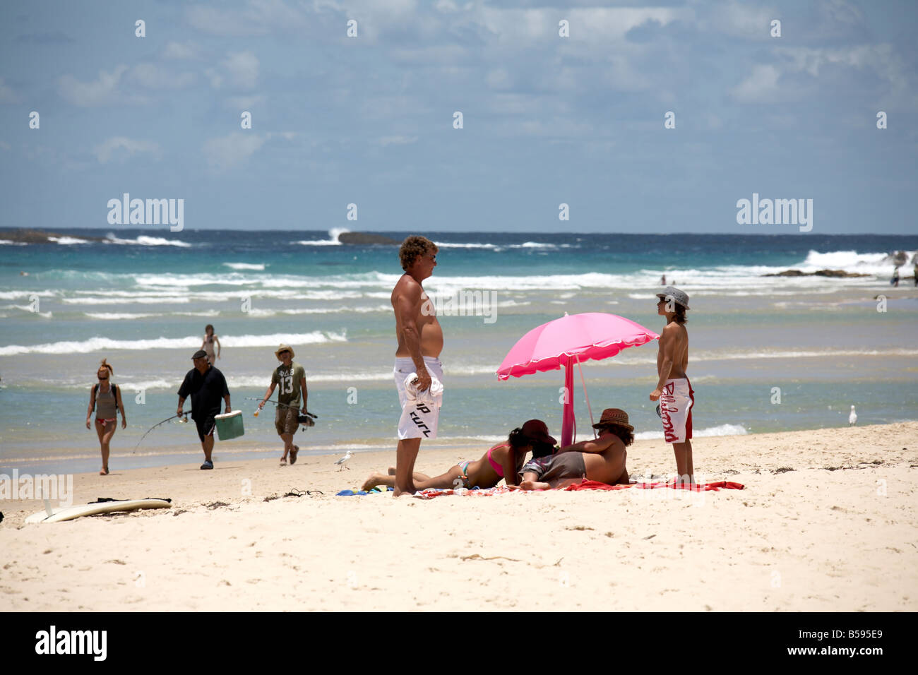 Deadmans beach with people fishing and sunbathing by the sea in summer on North Stradbroke Island Queensland QLD Australia Stock Photo