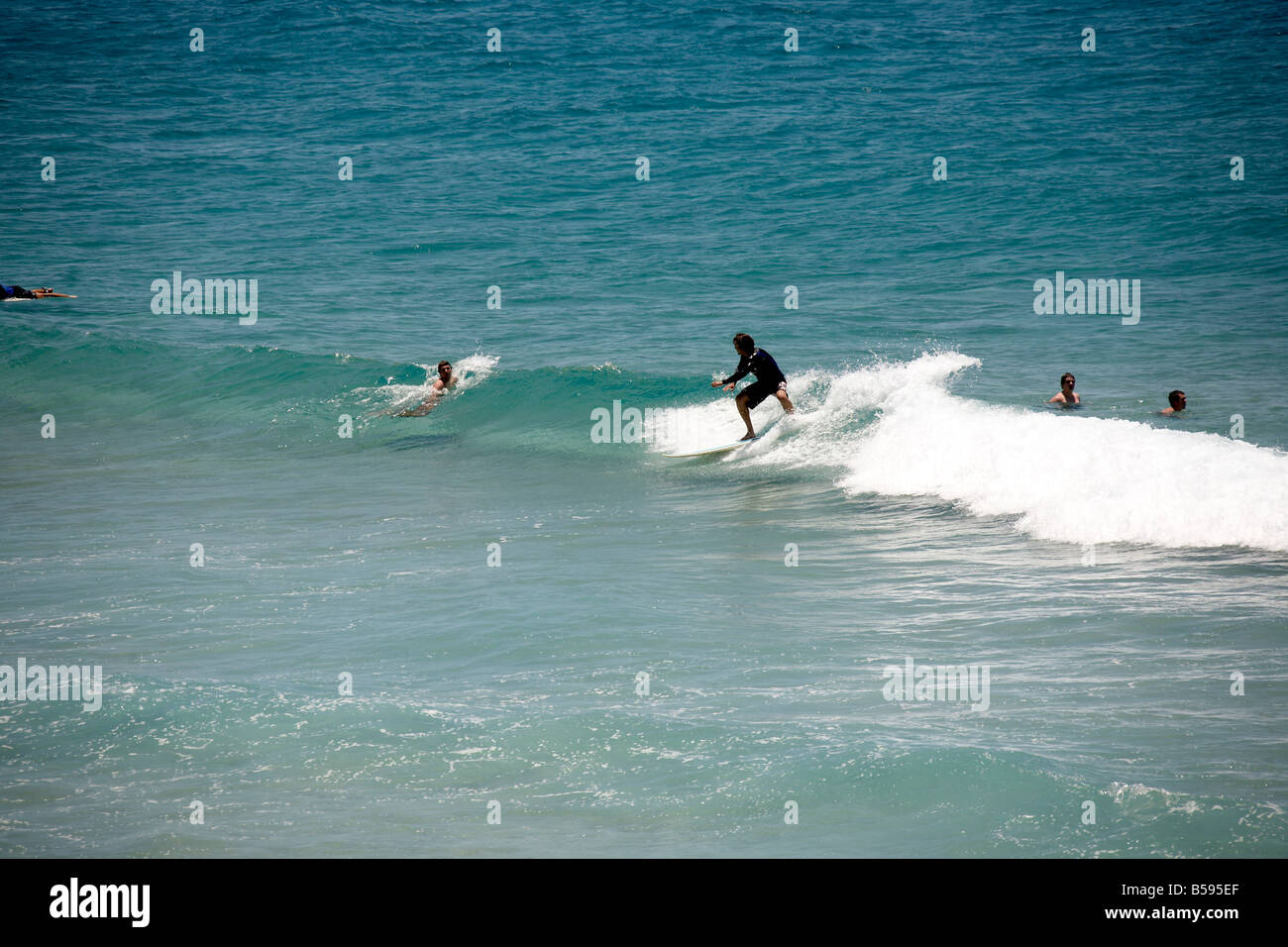 Surfer on Cylinder beach on North Stradbroke Island Queensland QLD Australia Stock Photo