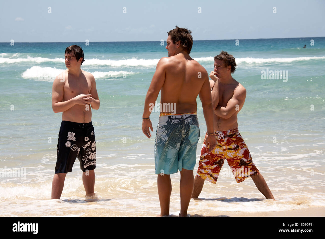 men standing in sea on Cylinder Beach 